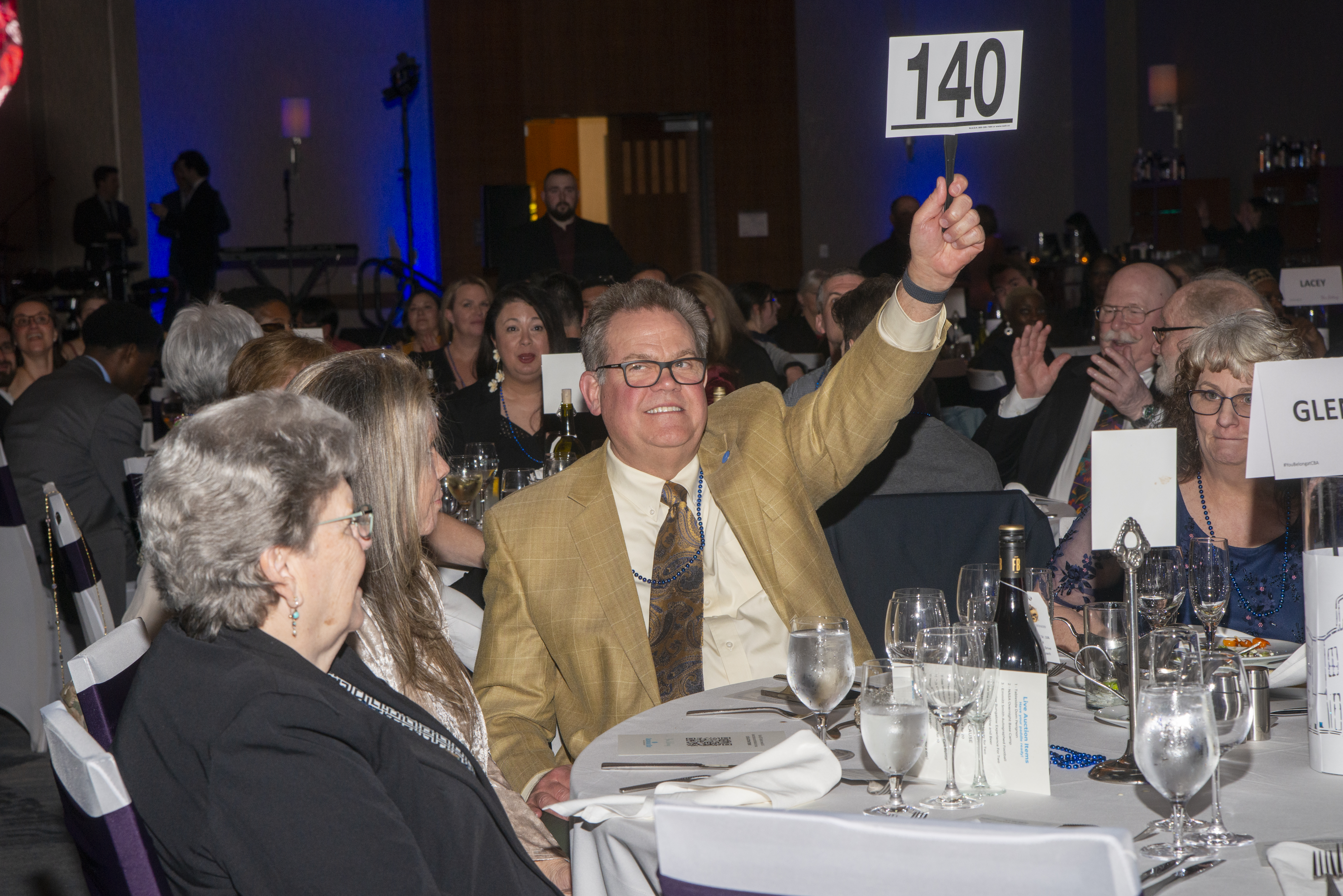 Man with Bidder Paddle
